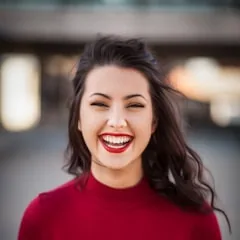 Smiling client in a red top