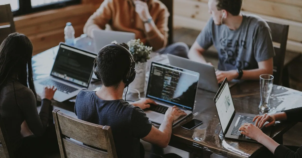 Developers collaborating on code during a software development sprint